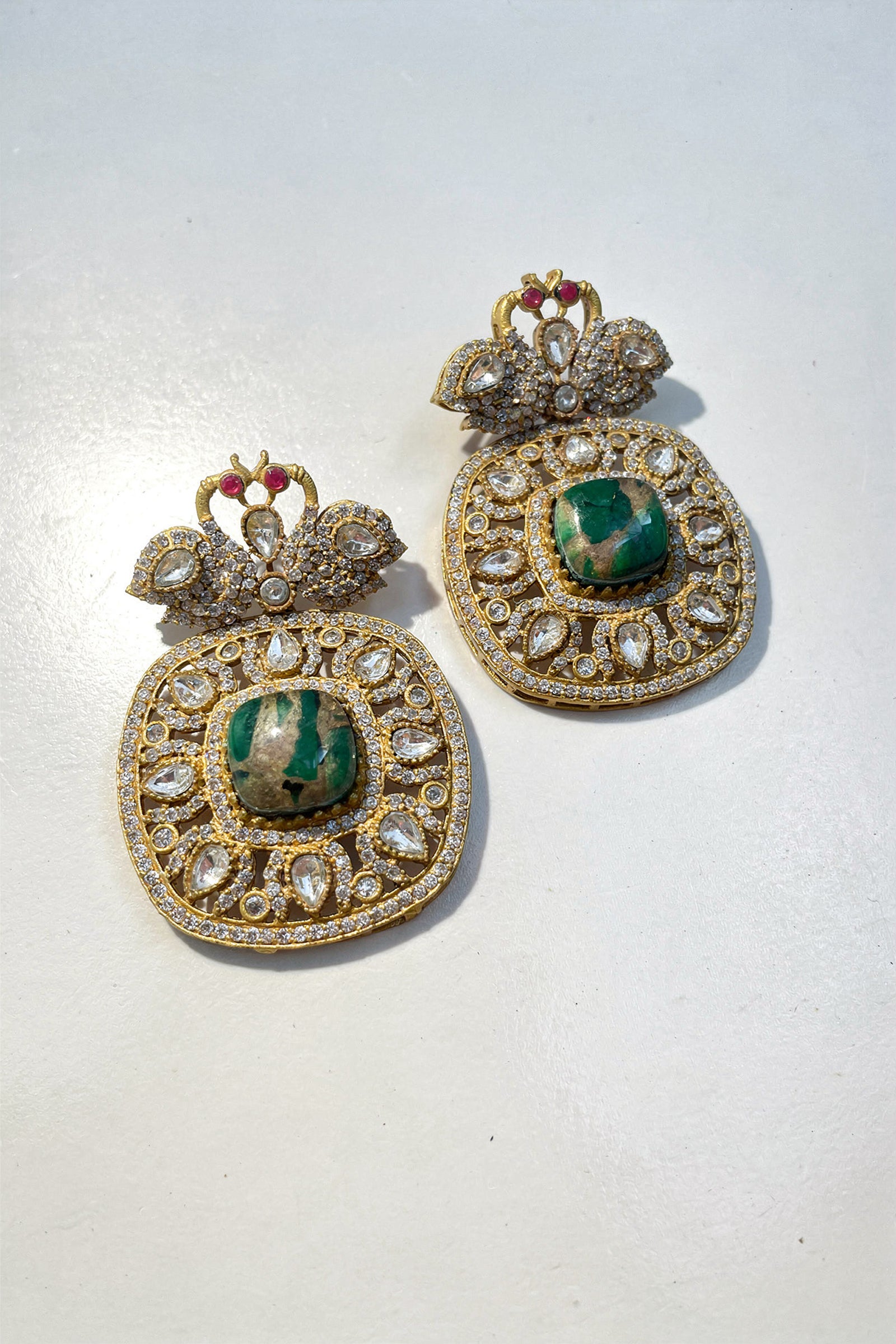 Gold Kundan-Style Green Stone Necklace Set with Intricate Filigree Detailing & Matching Earrings