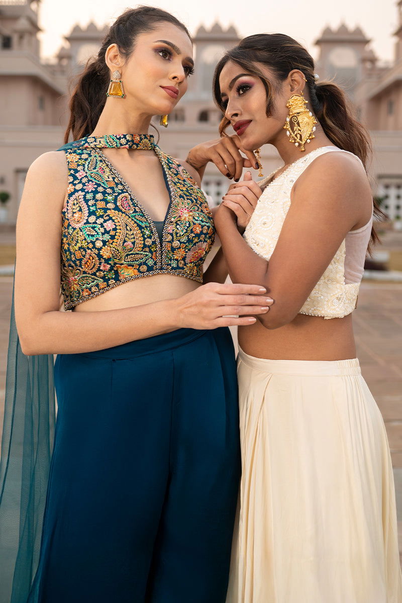 Gold Metal Paan-Shaped Earrings with Teardrop Pearls and Ghungroo Accents - Mayrake -
