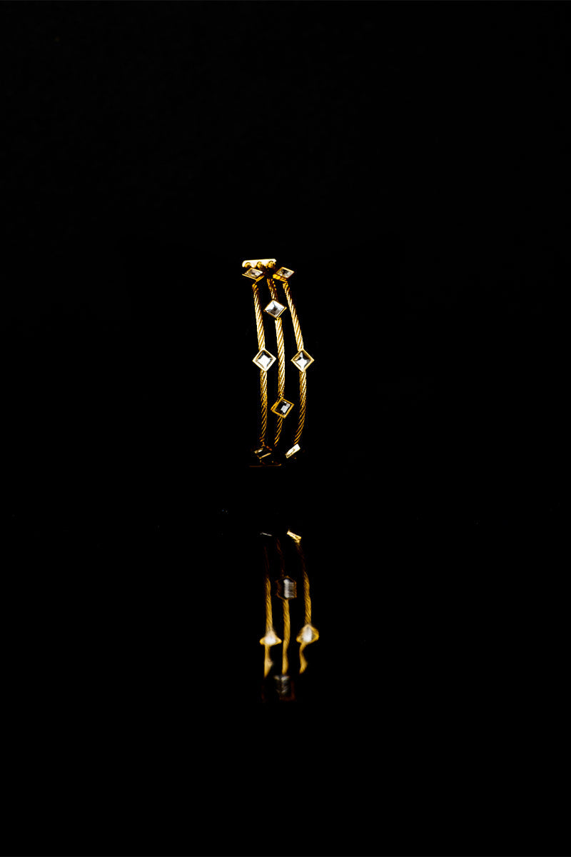 Golden layered metal bracelets with a stone link lock - Mayrake