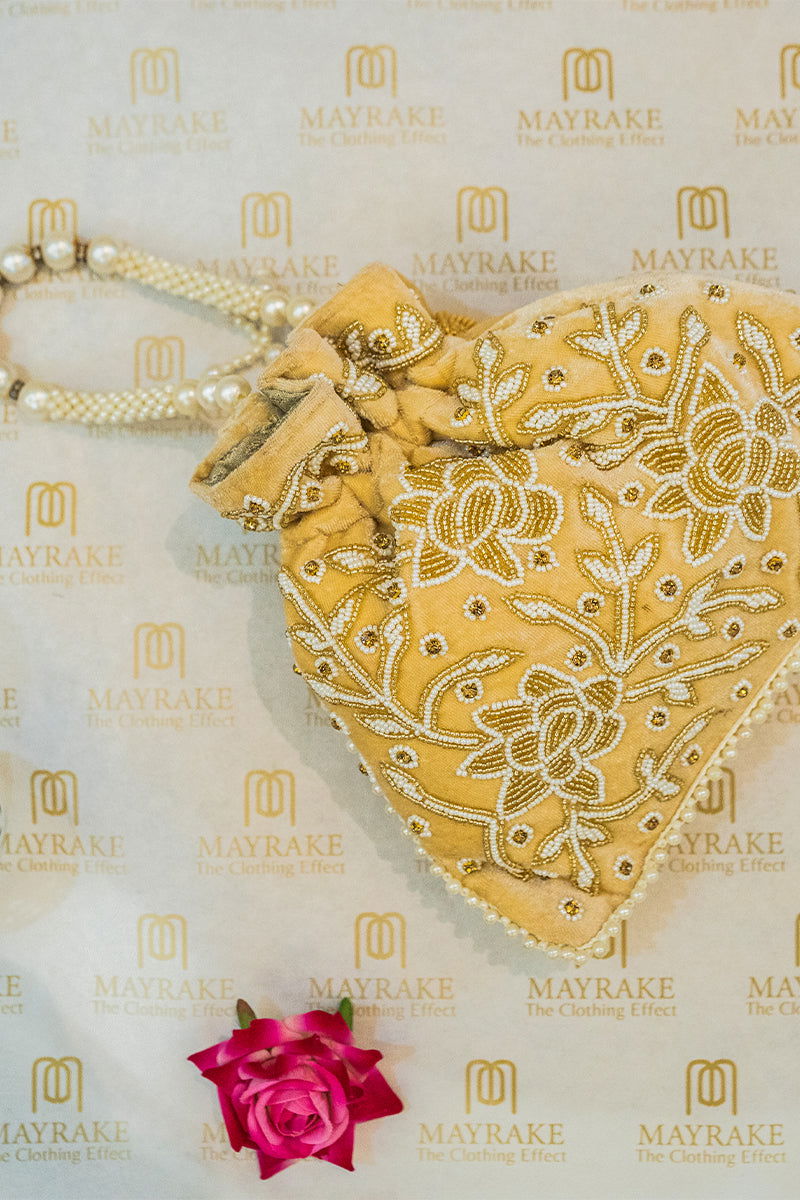 Handwork Beige Pearl and Bead Potli with Pearl Handle and Velvet Base - Mayrake.in