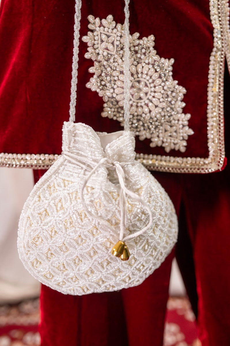 Milky White Potli with Pearl and Golden Thread Work