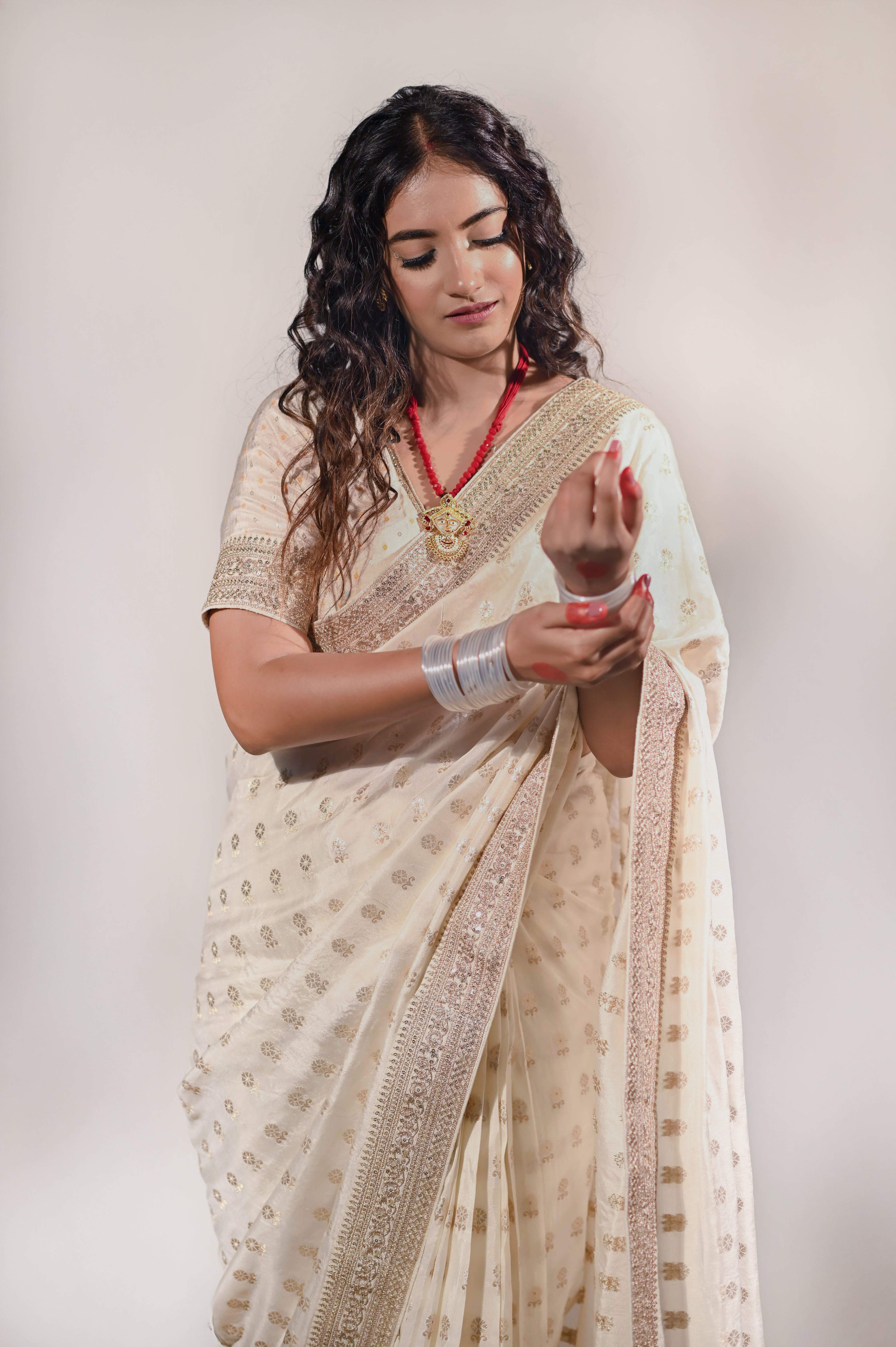 Cream Silk Saree with Golden Buti Work and Rich Zari Border