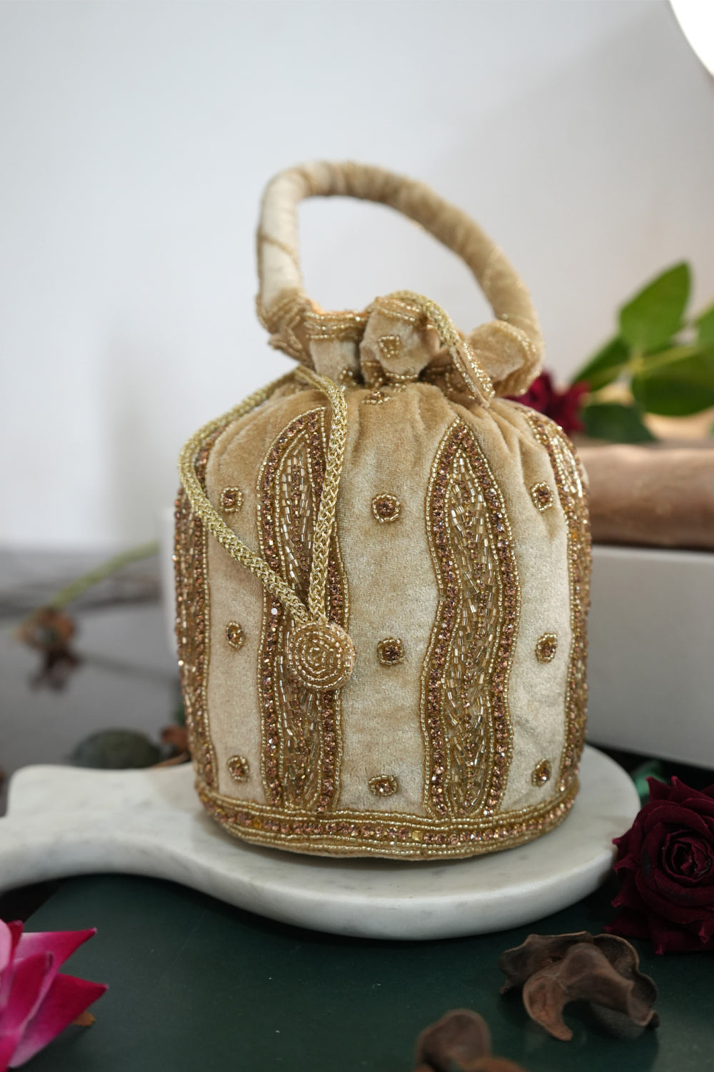 Beige Color Hanging Potli with Golden Beads and Zari Designs with Velvet Base