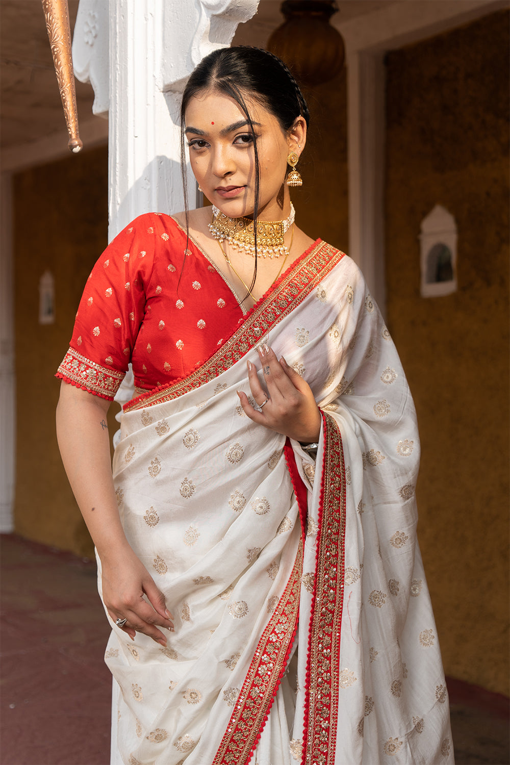 Cream Silk Saree with Golden Buti Work and Rich Red Zari Border