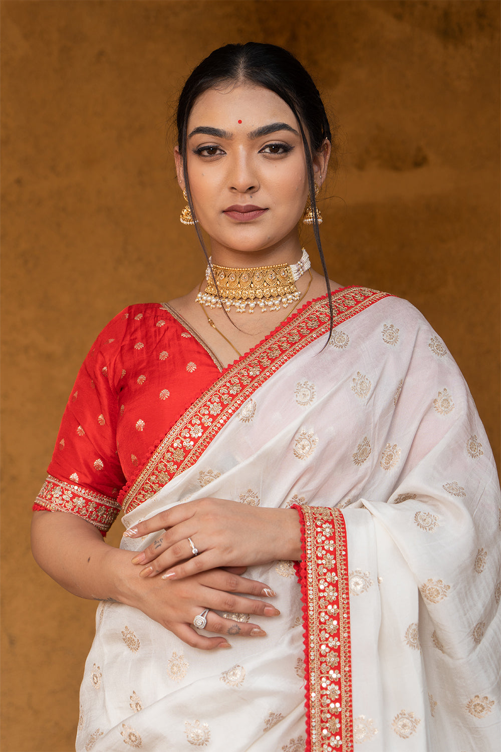 Cream Silk Saree with Golden Buti Work and Rich Red Zari Border