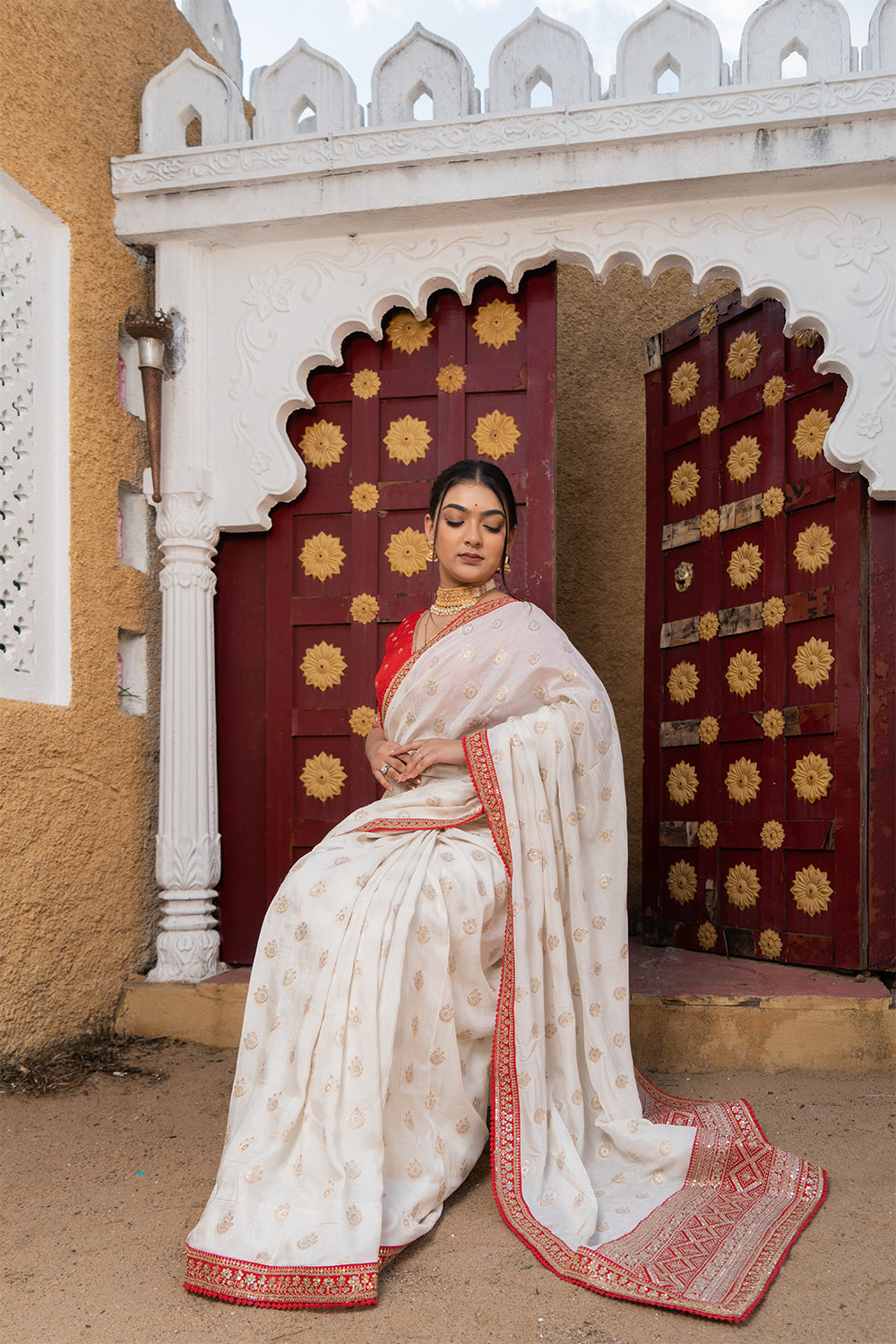 Cream Silk Saree with Golden Buti Work and Rich Red Zari Border