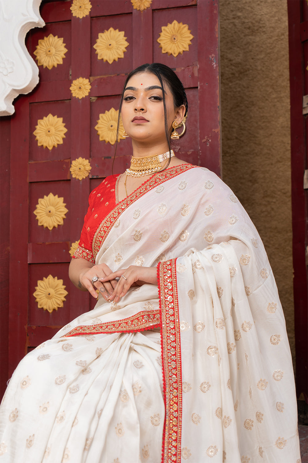 Cream Silk Saree with Golden Buti Work and Rich Red Zari Border