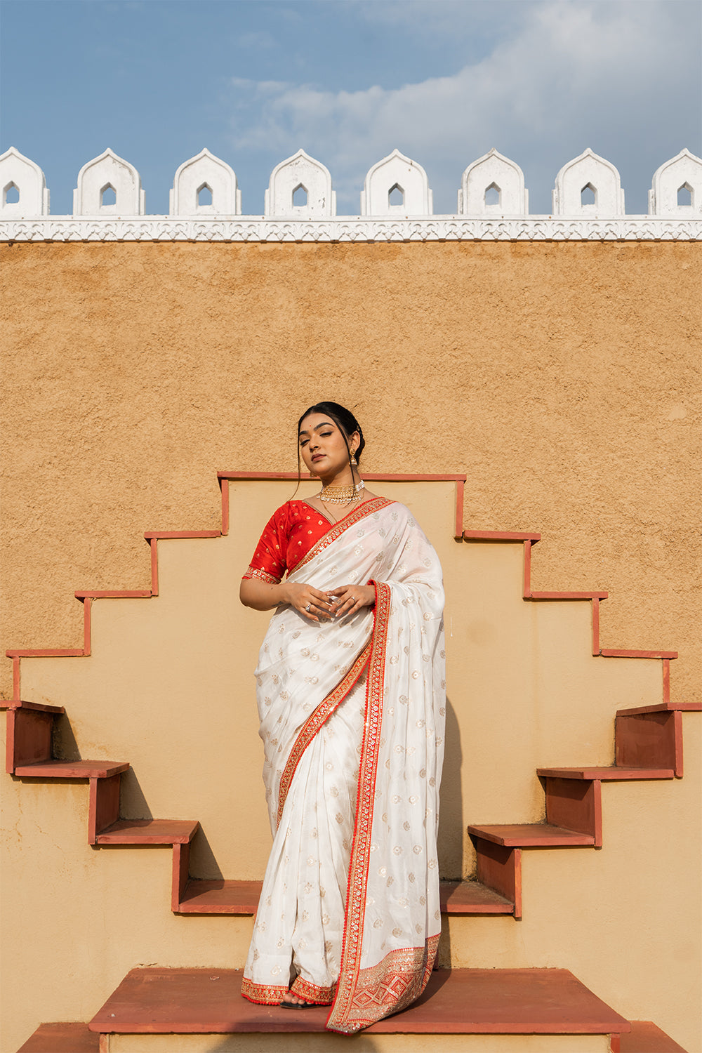 Cream Silk Saree with Golden Buti Work and Rich Red Zari Border