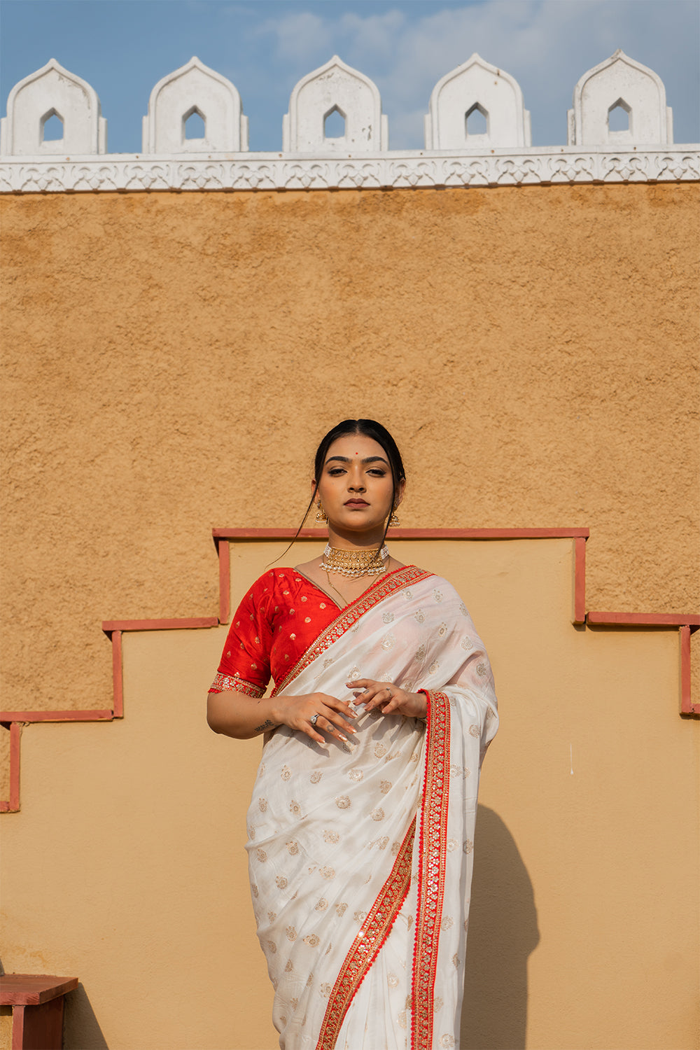 Cream Silk Saree with Golden Buti Work and Rich Red Zari Border