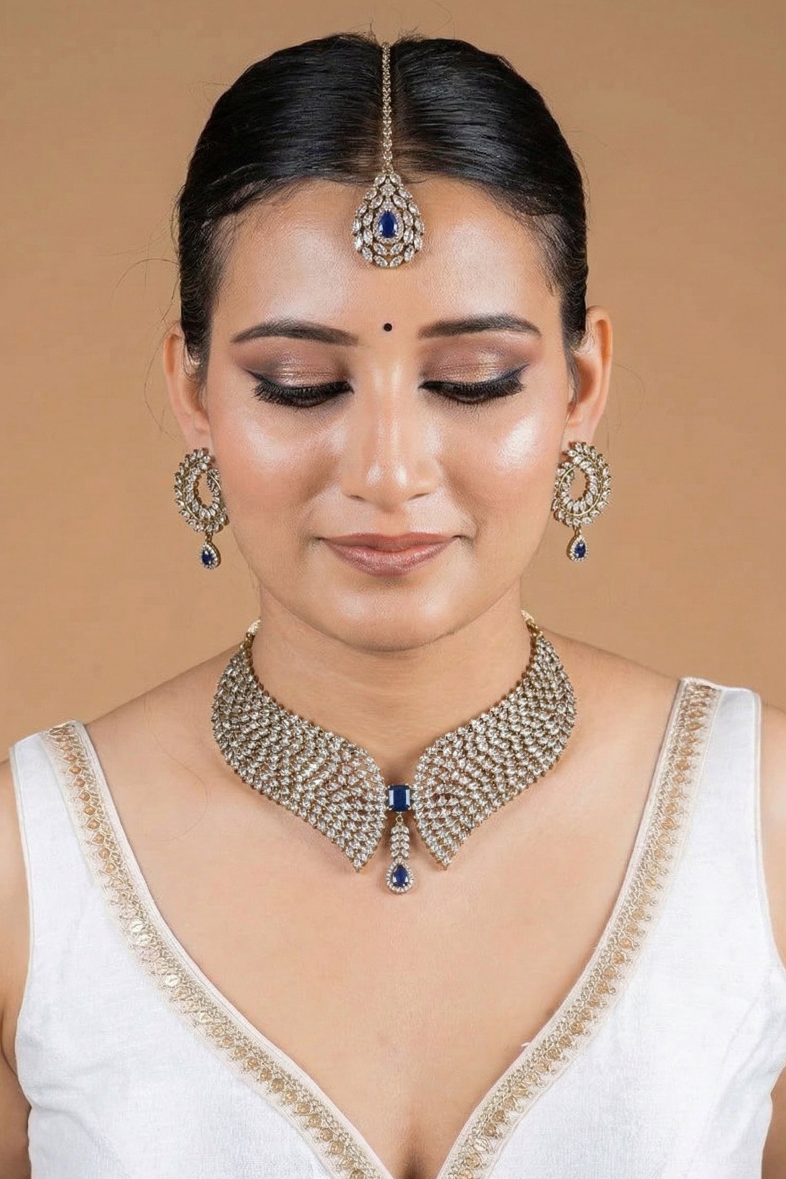 Gold Curved Diamond Collar Necklace with Midnight Blue Center Stone & Matching Stud Earrings