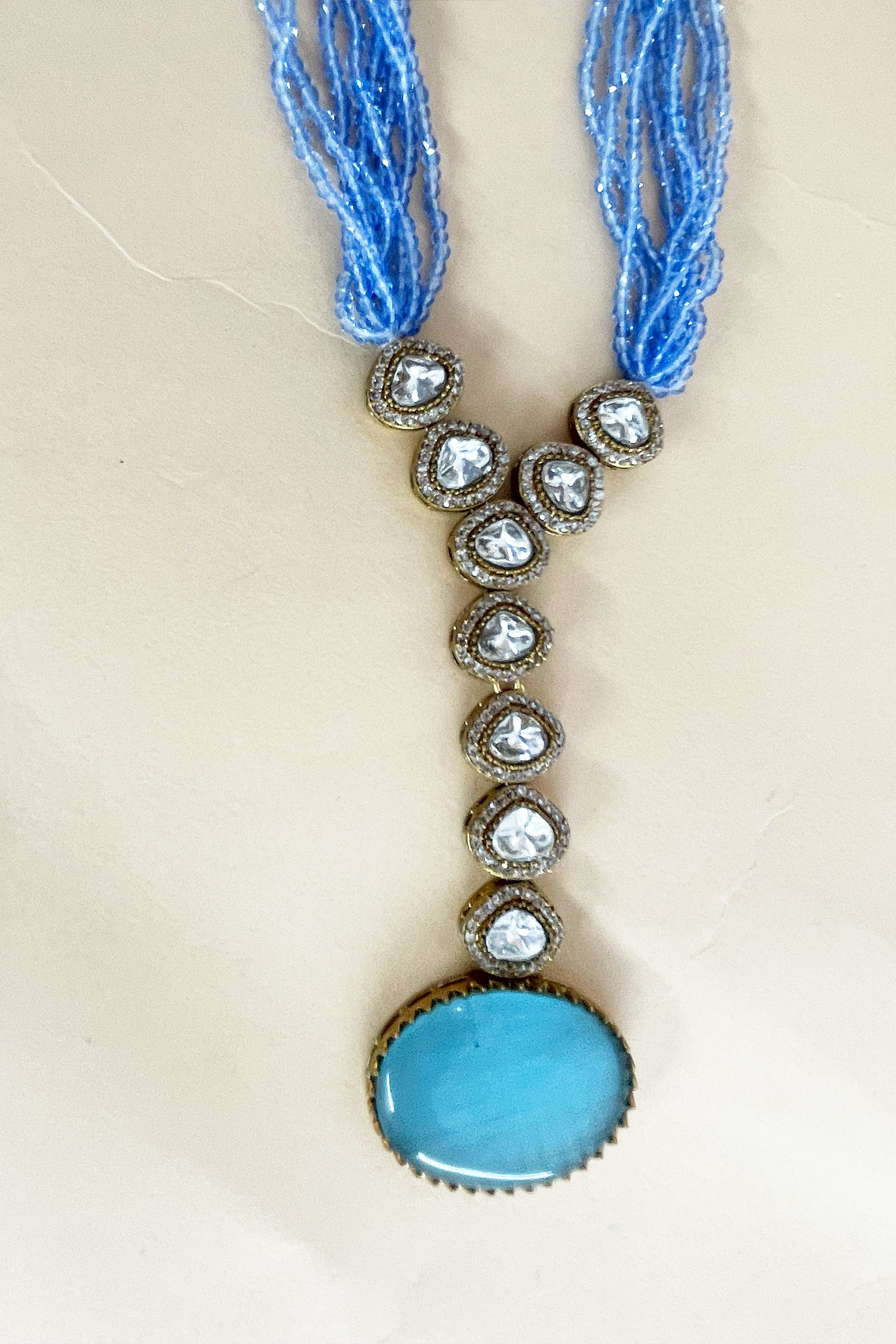 Sky Blue Multi-Strand Beaded Necklace with Antique Gold Oval Pendant & Matching Drop Earrings