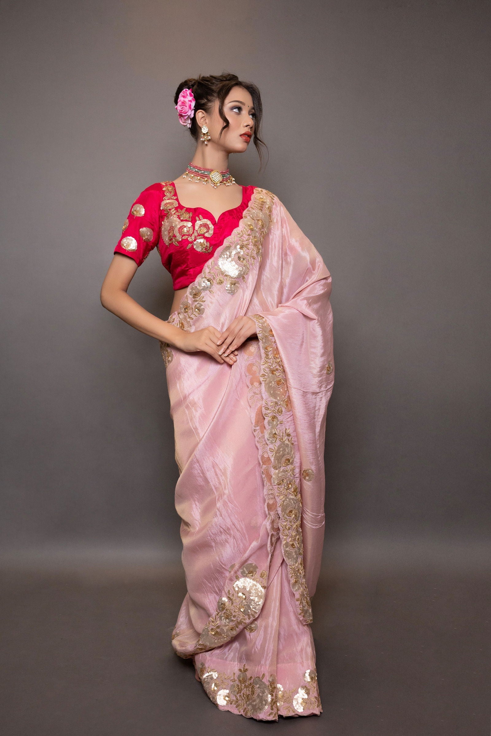A pastel pink saree with intricate gotapatti and pitta work on the pallu and border, paired with stitched designer blouse - Mayrake