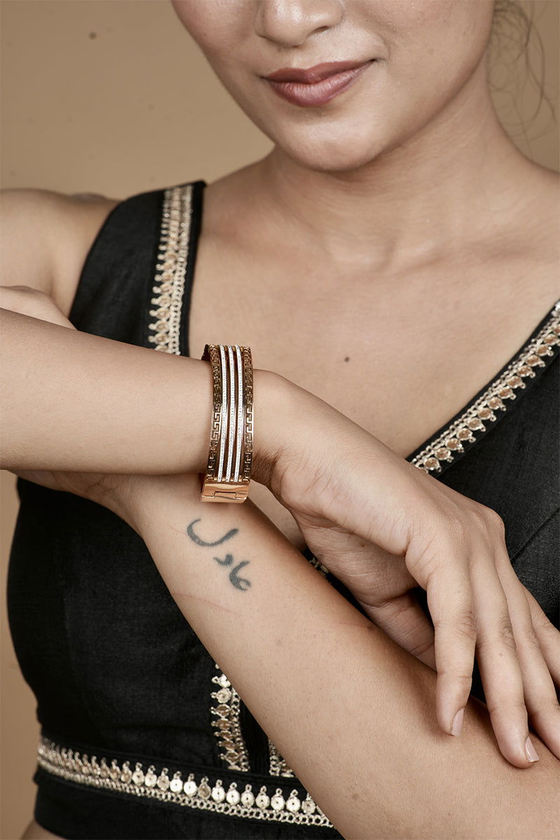 Copper metal finish bracelet with American Diamond stones and featuring a secure lock - Mayrake