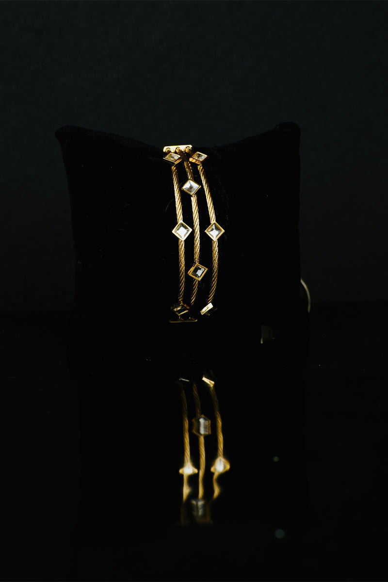 Golden layered metal bracelets with a stone link lock - Mayrake