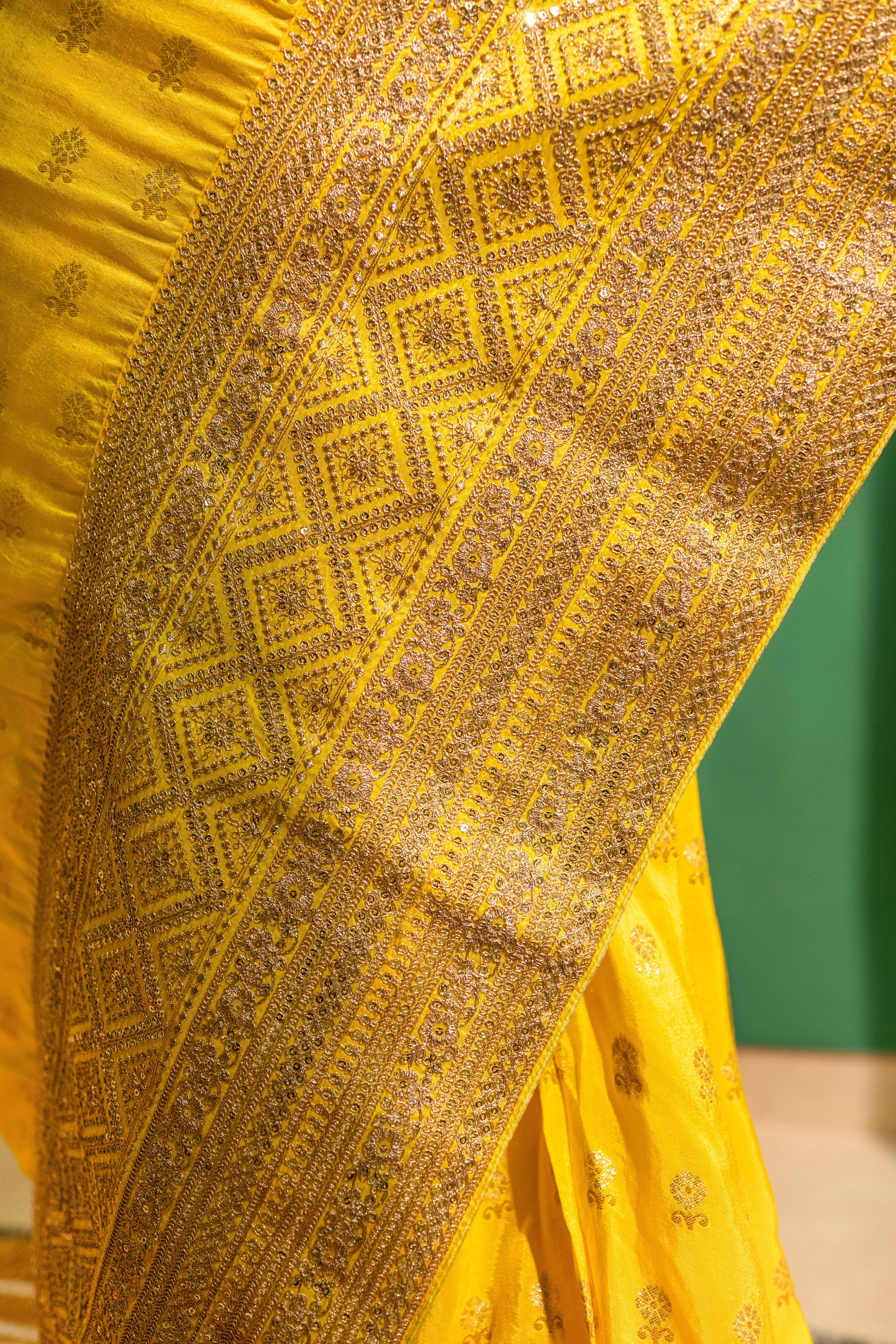 Yellow Silk Saree with Golden Buti Work and Rich Zari Border