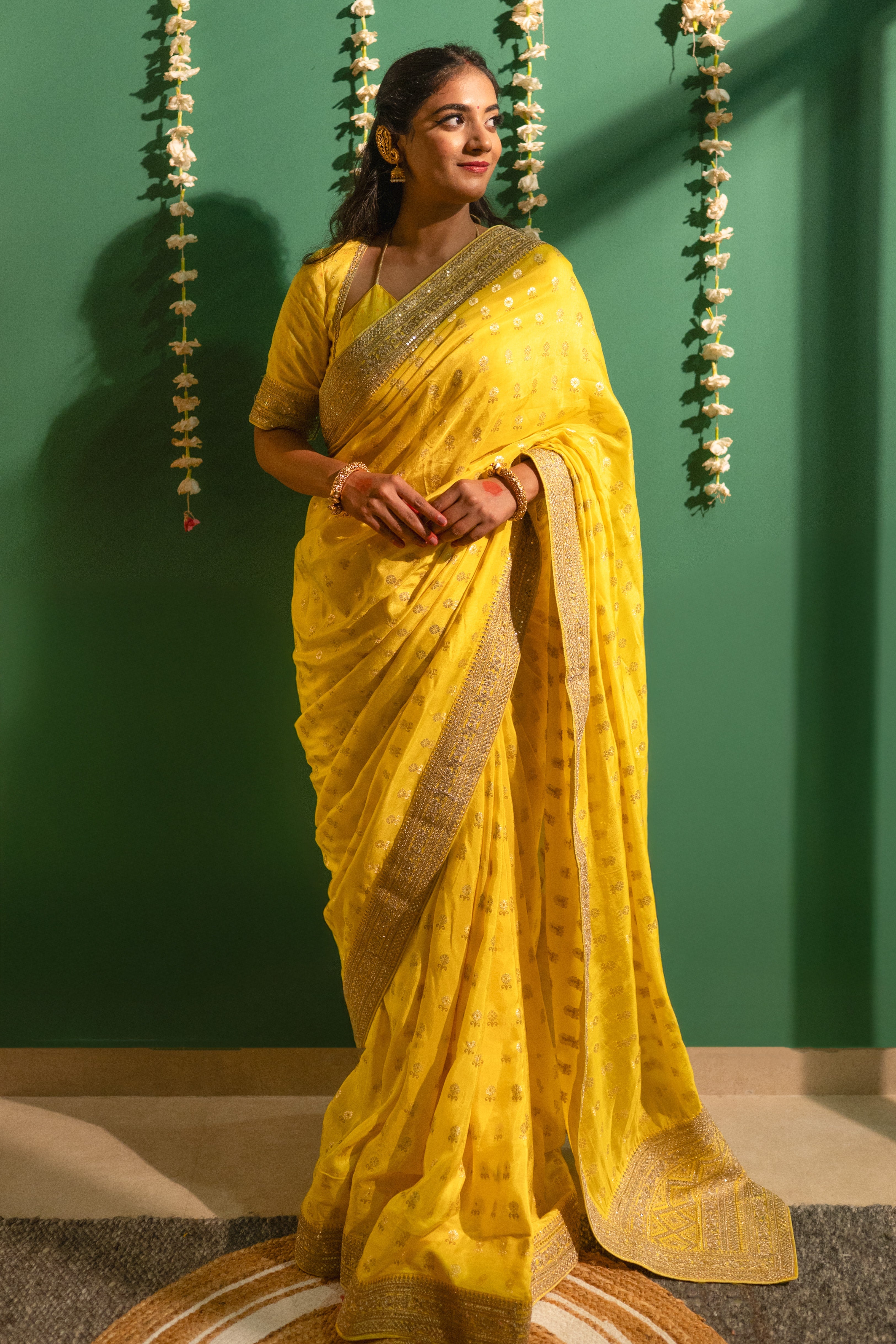 Yellow Silk Saree with Golden Buti Work and Rich Zari Border