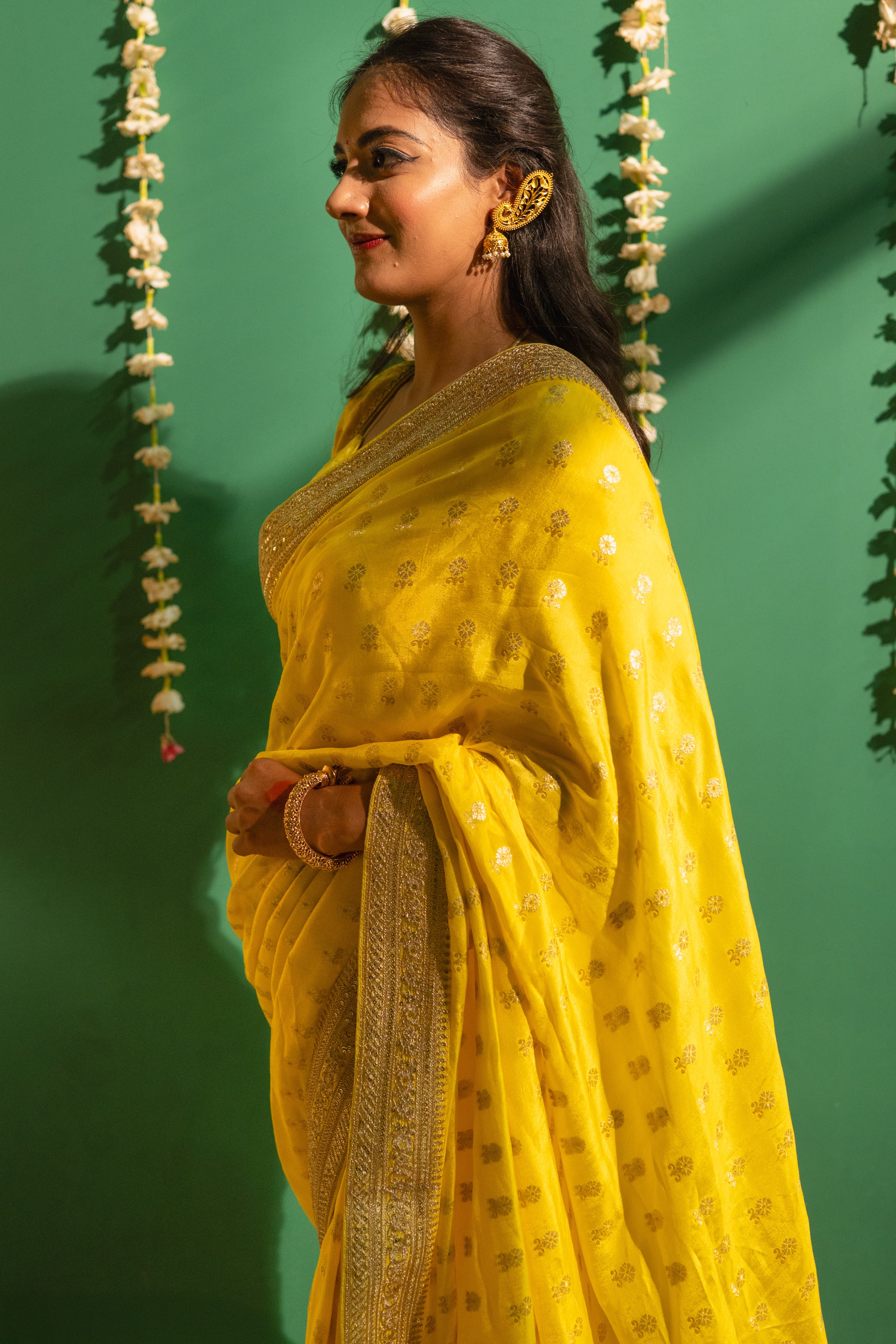 Yellow Silk Saree with Golden Buti Work and Rich Zari Border