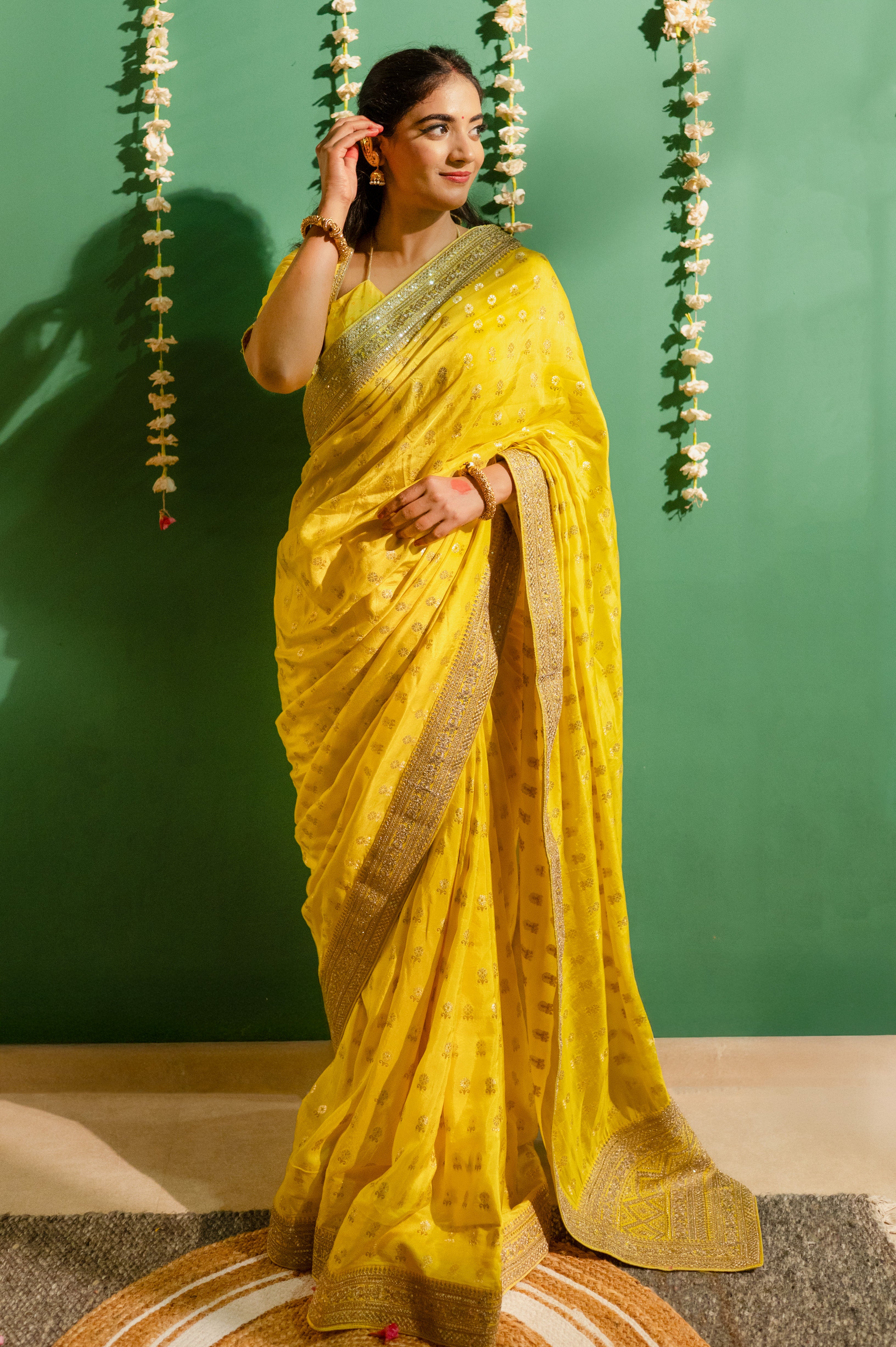 Yellow Silk Saree with Golden Buti Work and Rich Zari Border