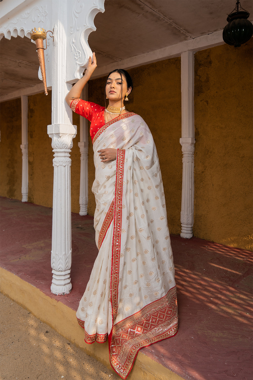 Cream Silk Saree with Golden Buti Work and Rich Red Zari Border